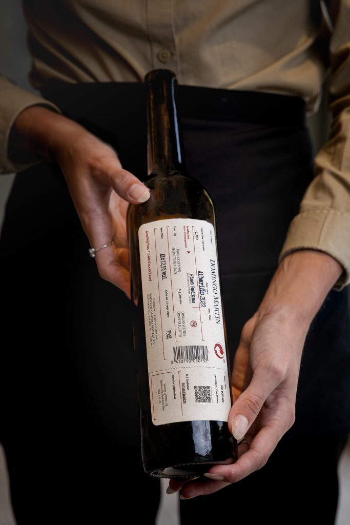 Close-up of a wine bottle being presented by staff during private dining service at Siddington Park, photographed by Lou Carruthers, Lou Carruthers Photography, Hospitality & Drinks Photographer, Cotswolds and Menorca
