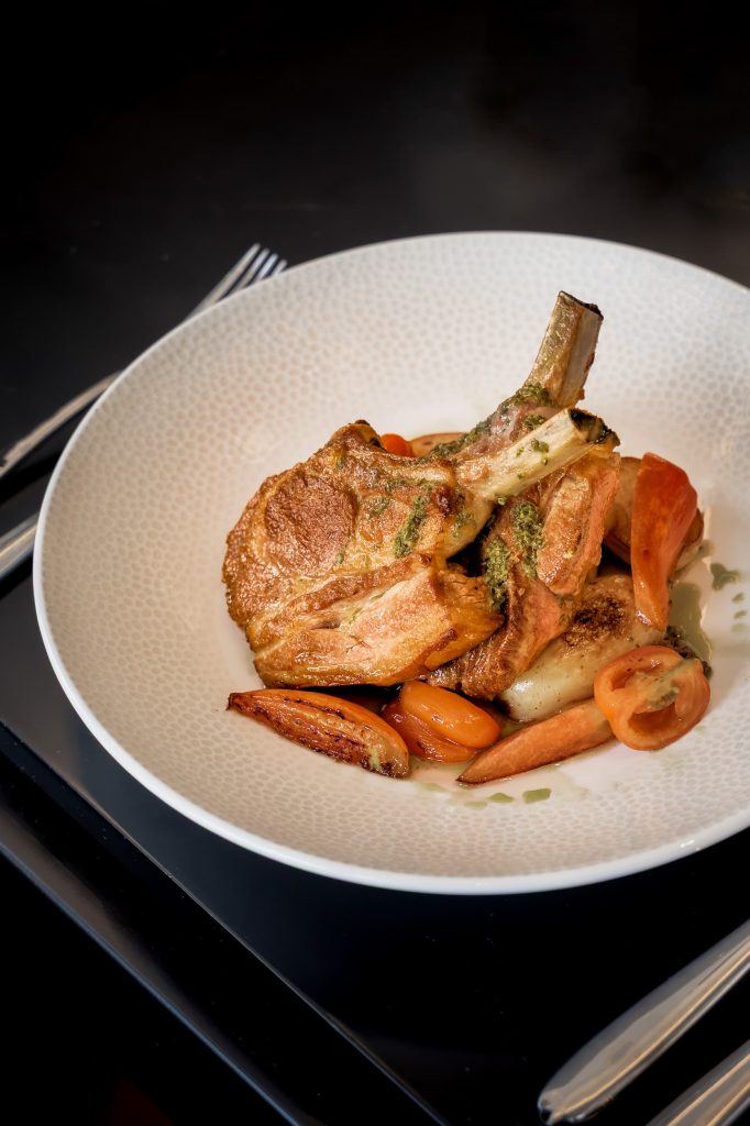 Seasonal lamb dish served with glazed vegetables on a textured white plate in the private dining room at Siddington Park, photographed by Lou Carruthers, Lou Carruthers Photography, Hospitality & Drinks Photographer, Cotswolds and Menorca